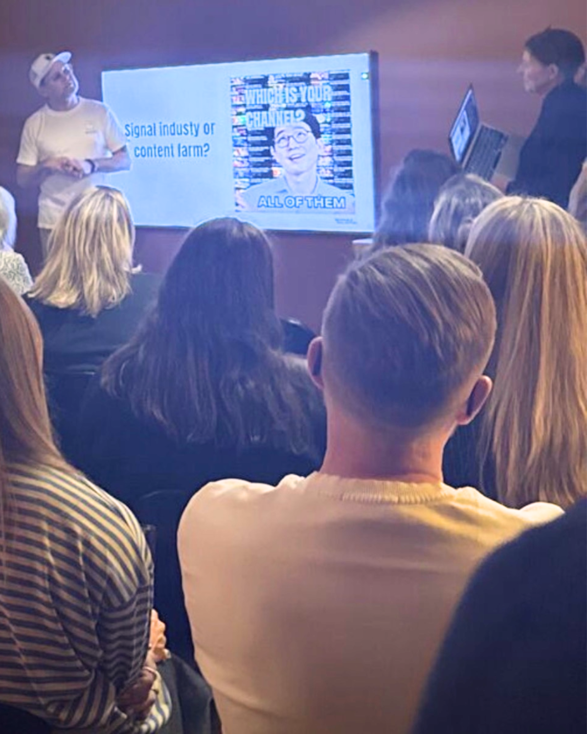Audience watching a presentation during AI BAREN.